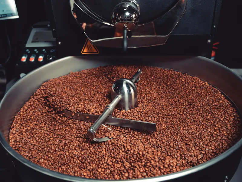 Roasted coffee turning in the drum of our 15 kg roaster