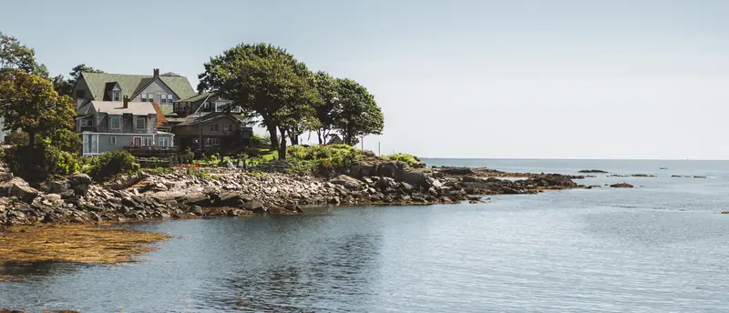 Shingled houses on a rocky point of the Portland, Maine shoreline