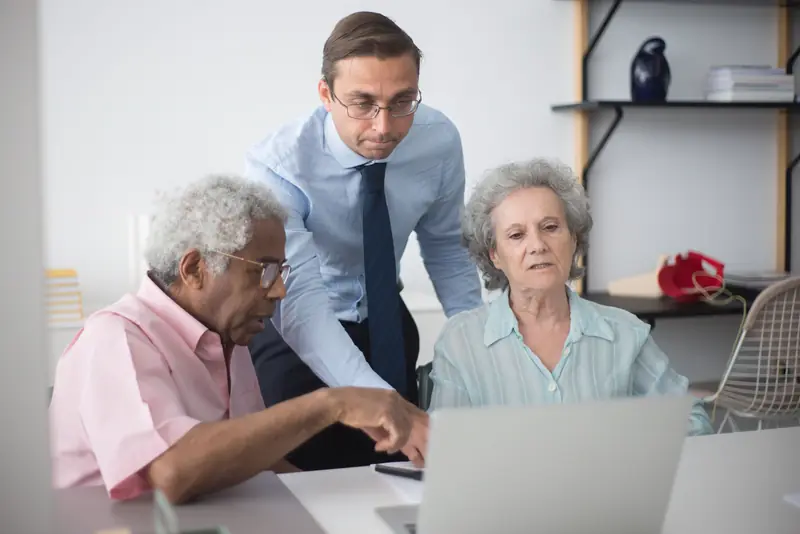 A Harborline agent reviews policy options with a couple at their kitchen table