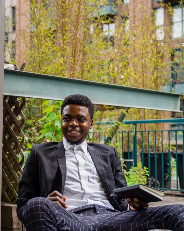 Portrait of Marcus Bell outdoors with a tablet