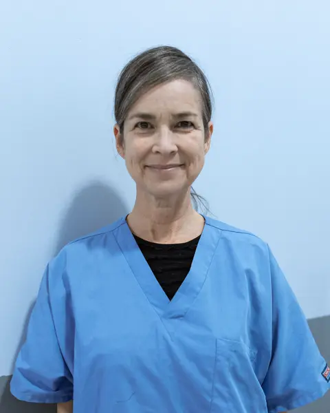 Portrait of Linda Kowalski in blue scrubs.