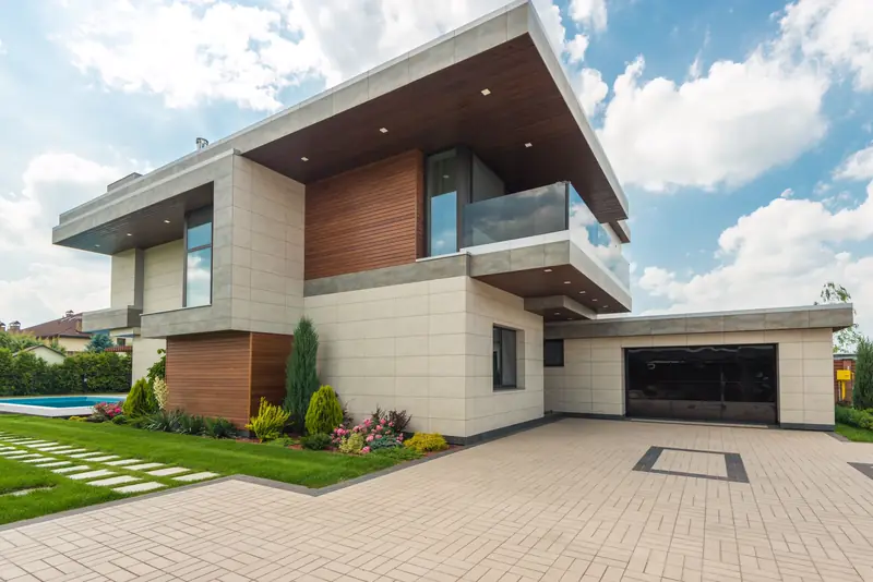 Two-story modern home with white panels and cedar accents