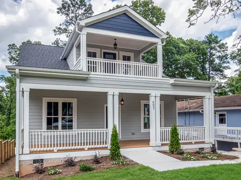White two-story house with covered porches on both floors