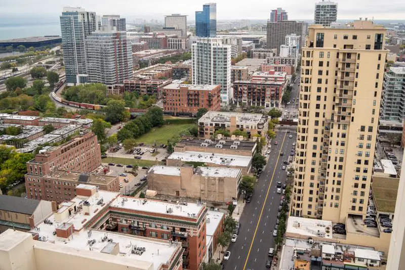 Aerial view of downtown Chicago towers and low-rise rooftops