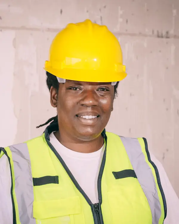 Tasha Greene, claims coordinator, wearing a hard hat and safety vest