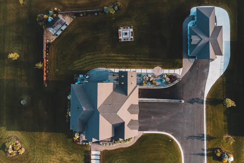 Drone photo looking straight down on a home and detached garage before an inspection