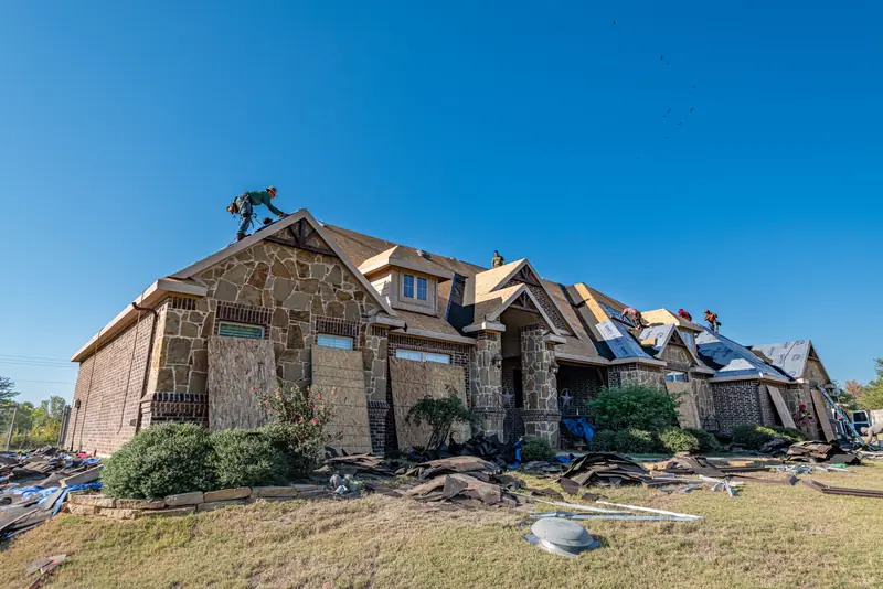 Brick home in Aledo during a roof installation