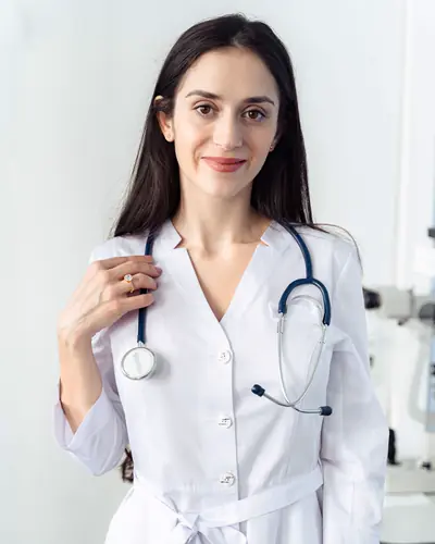 Dr. Maya Ellison in a white coat with a stethoscope